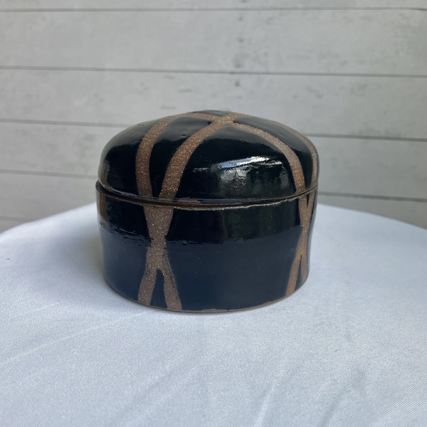 Small black geometric jar