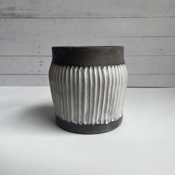 Dark brown & white fluted vase