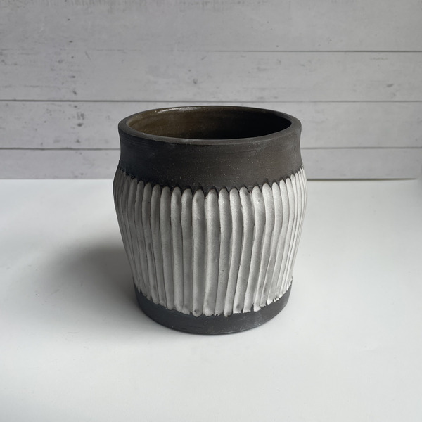 Dark brown & white fluted vase